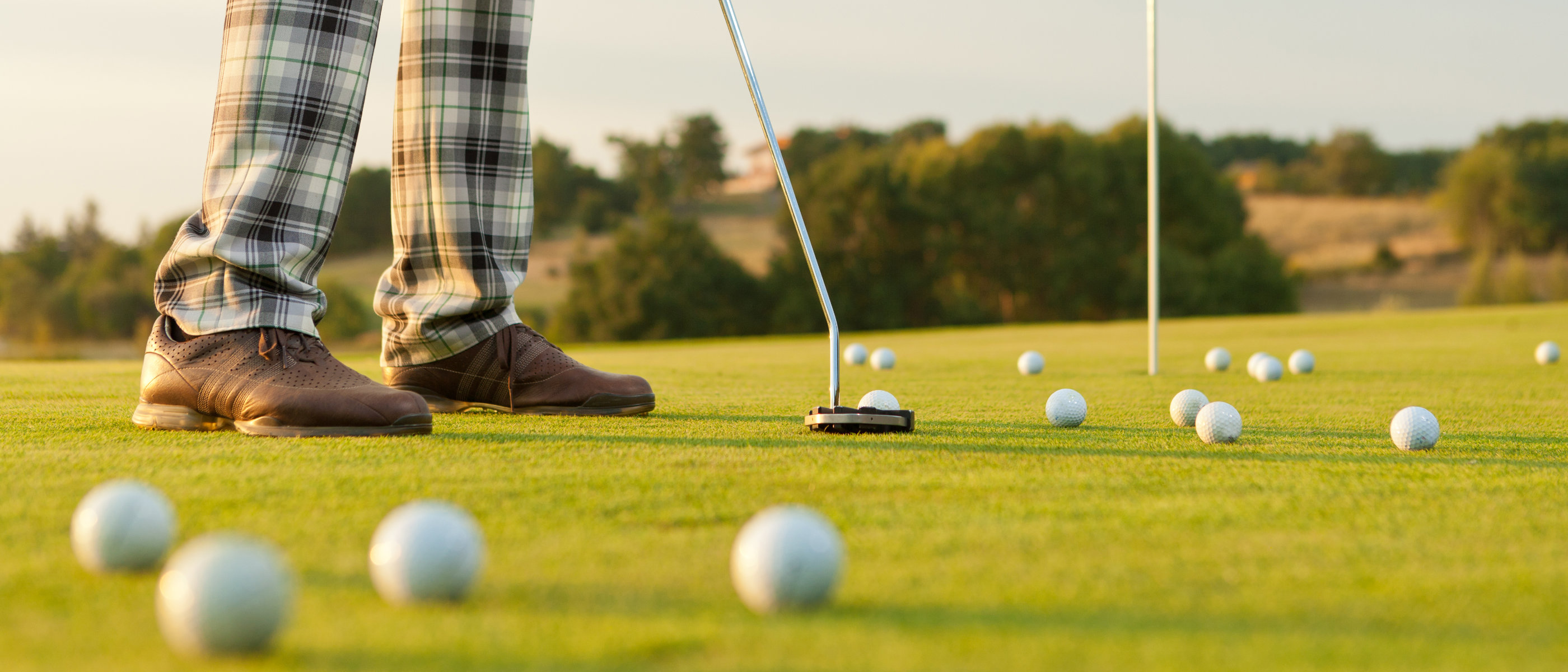 Golfer Practicing On Green